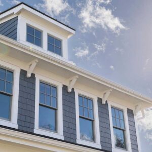Masthead_ExteriorWindowsreduced The second and third story of an exterior house with many windows and white trim.