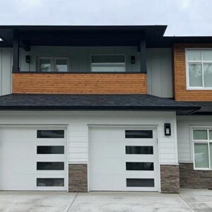 Gallery38 A modern pacific-northwest style house with grey, white and black colours and wood accents.